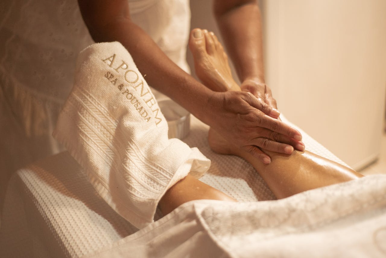 Mastering the First Impression: Your intriguing post title goes here Close-up of a foot massage at Aponema Spa, emphasizing relaxation and wellness.